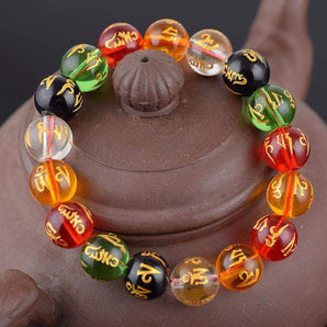 Bracelet energie en perle de verre Om Mani Padme Hum