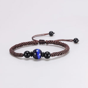 Bracelet Shamballa Œil de tigre bleu sur cordon tissé