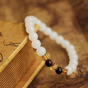 Bracelet «Vitalité et Confiance» en Calcédoine blanche et Grenat naturel